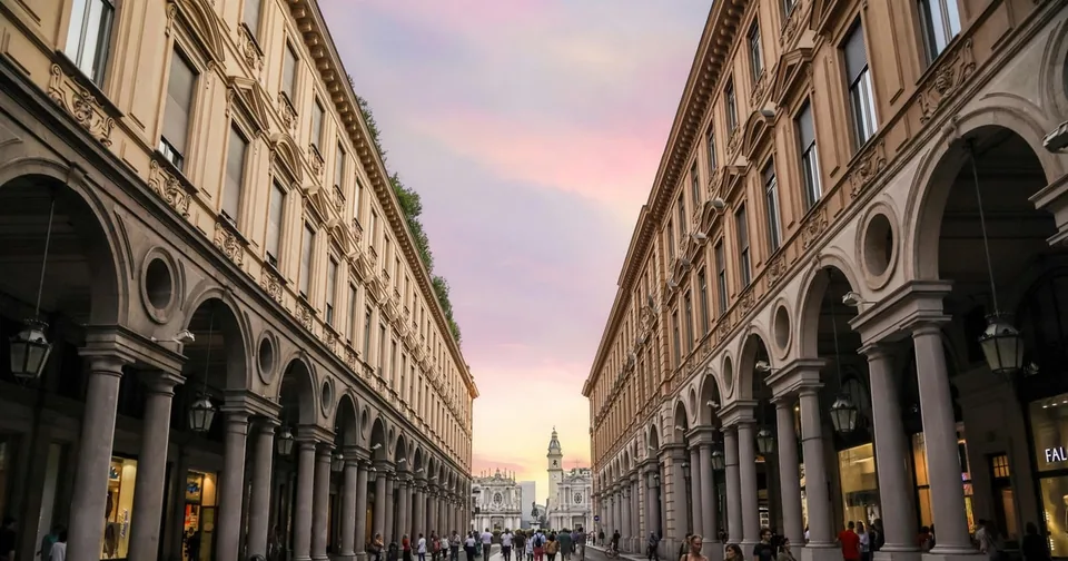 The arcades of via Roma at sunset, with the perspective towards the centre